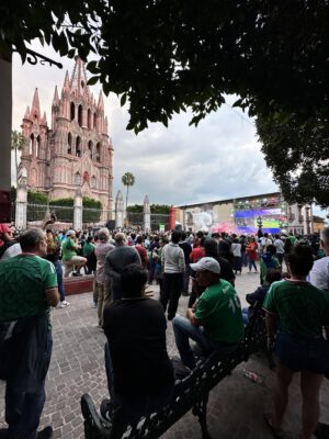 People celebrating the FIFA World Cup in San Miguel de Allende's Jardín Principal